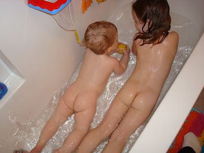 Nude boy bath time
