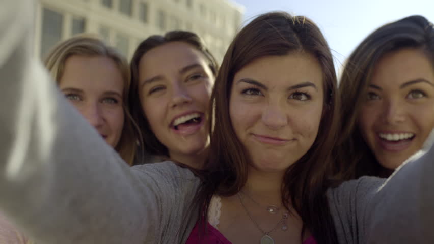 Young teen girls group selfies