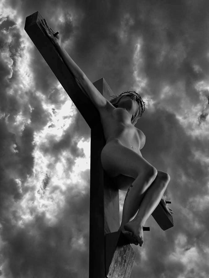 Naked women crucified on cross