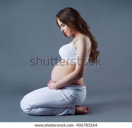 kneeling Pregnant woman